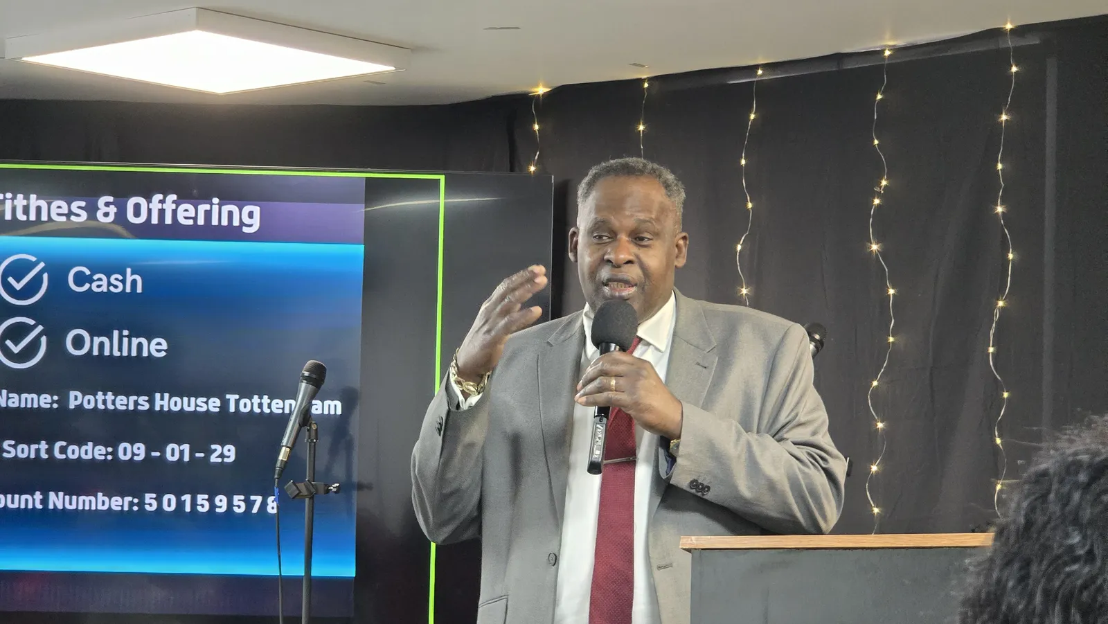 A preacher speaking from the pulpit during a service